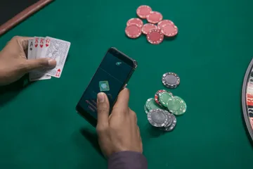 A close-up shot of golden coins falling around a spinning roulette wheel, representing immersive casino action at 1XBEF.