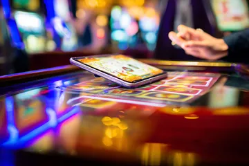 A person using their device against a moody casino-themed background, illustrating the smooth re-entry process at 1XBEF.